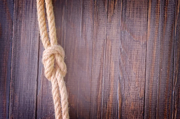 Rope on wooden background — Stock Photo, Image