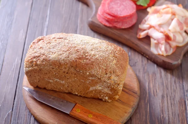 Bread, salami and bacon — Stock Photo, Image