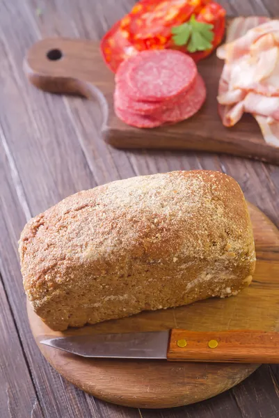 Bread, salami and bacon — Stock Photo, Image