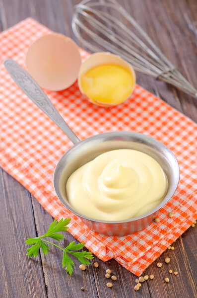 Mayonnaise in metal spoon