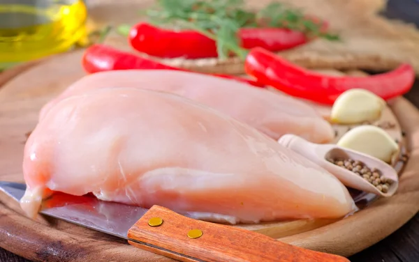 Chicken on a wooden board — Stock Photo, Image