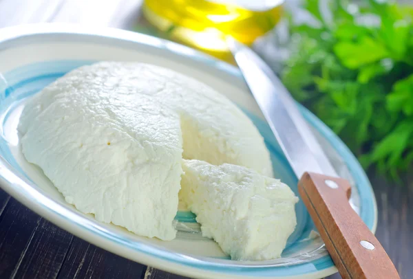 Cheese in a plate — Stock Photo, Image