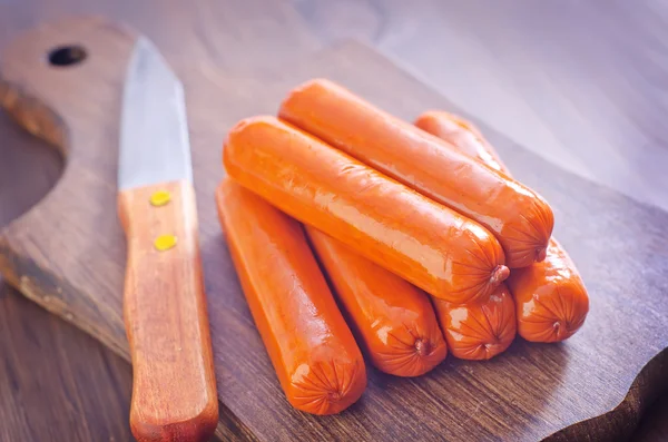 Sausages on board — Stock Photo, Image