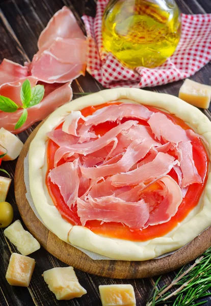 Pizza on a wooden board — Stock Photo, Image