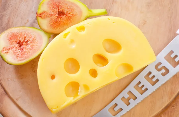 Cheese on a wooden board — Stock Photo, Image