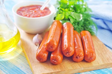 Sausages with greens clipart