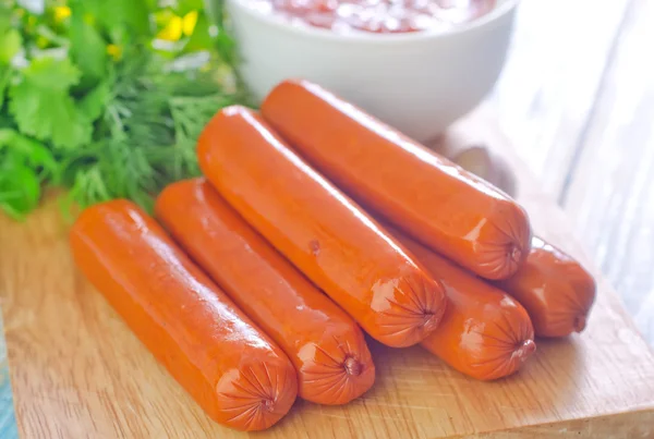 Sausages with greens — Stock Photo, Image