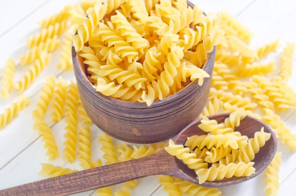 Pasta in a wooden bowl — Stock Photo, Image