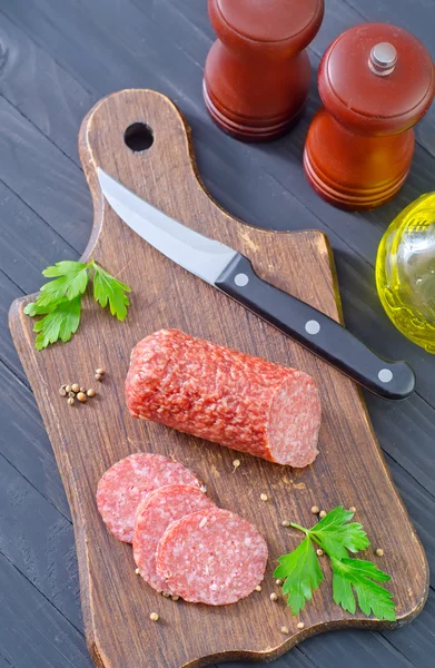 Salami on a cutting board — Stock Photo, Image