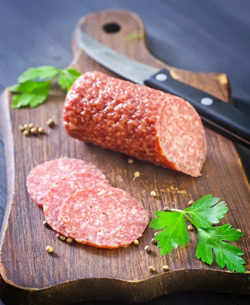 Salami on a cutting board — Stock Photo, Image