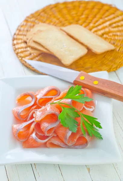 Salmon and toasts — Stock Photo, Image