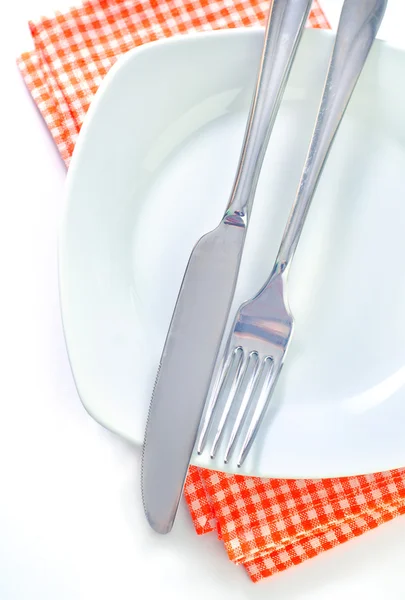 Fork and knife on plate — Stock Photo, Image