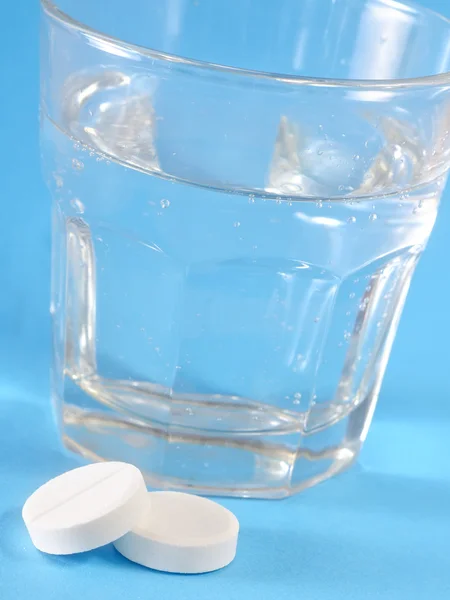 Pills and water Stock Image
