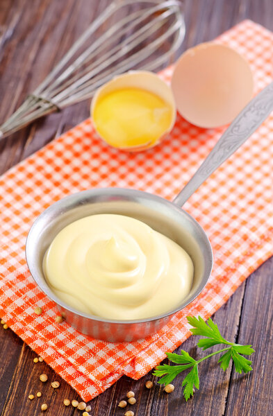 Mayonnaise in metal spoon