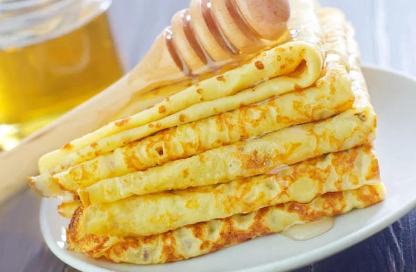 Pancakes with honey — Stock Photo, Image