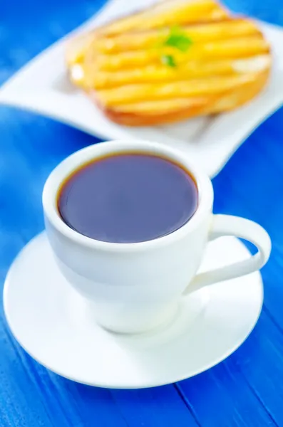 Coffee on a wooden table — Stock Photo, Image