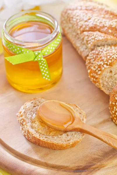 Honig und Brot — Stockfoto