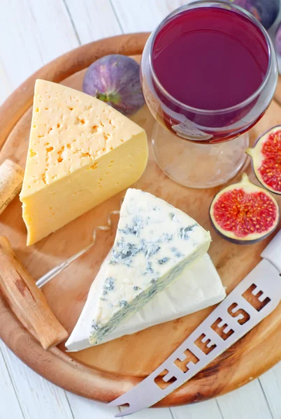 Cheese on a wooden board — Stock Photo, Image