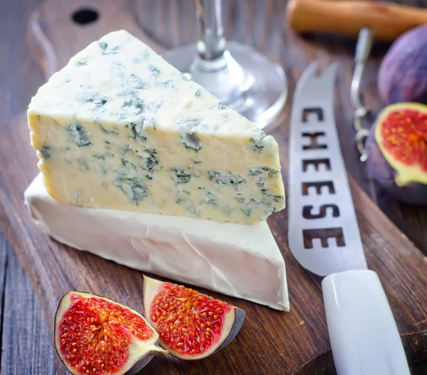 Cheese on a board — Stock Photo, Image