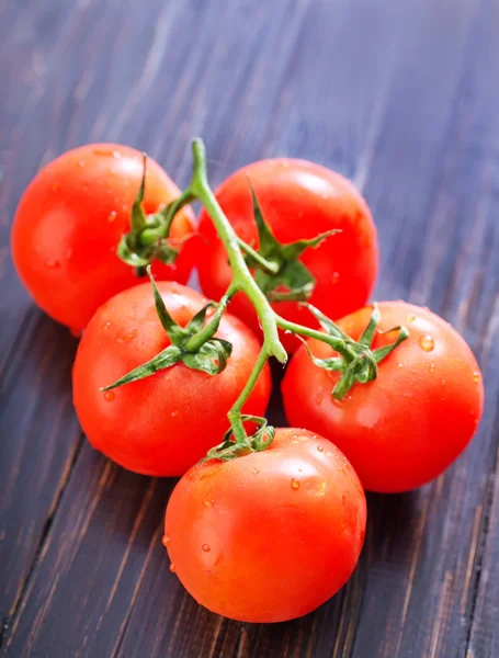 Tomato on table — Stock Photo, Image