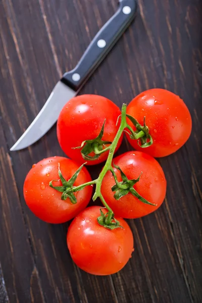 Tomato on table — Stock Image Tomato on table Royalty Free Stock Photos