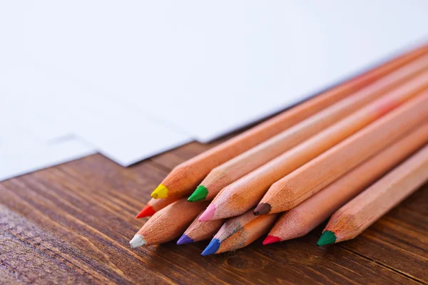 Paper and colored pencils — Stock Photo, Image