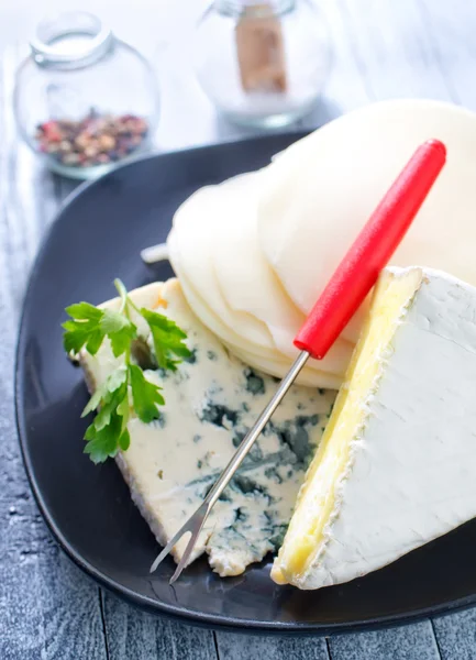 Cheese in a plate — Stock Photo, Image