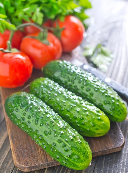 Cucumbers and tomato — Stock Photo, Image