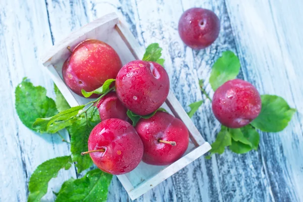 Plums in box — Stock Photo, Image