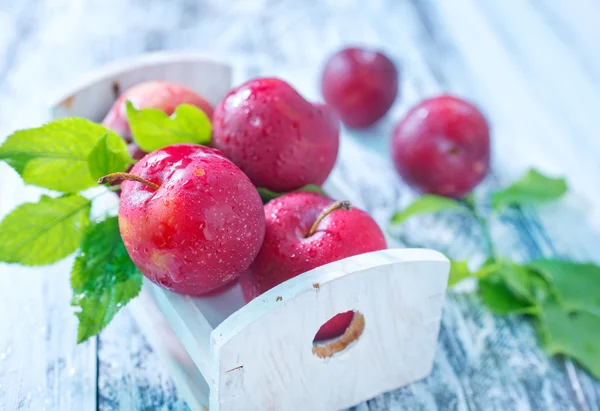 Plums in box — Stock Photo, Image