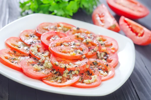 Tomato with basil and garlic — Stock Photo, Image