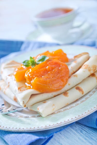 Pancakes with apricots — Stock Photo, Image