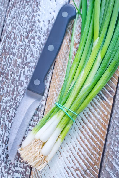 Onion and knife — Stock Photo, Image