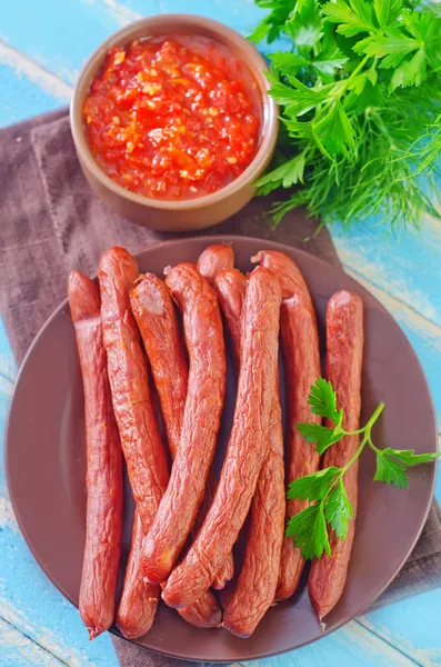 Sausages and sauce — Stock Photo, Image