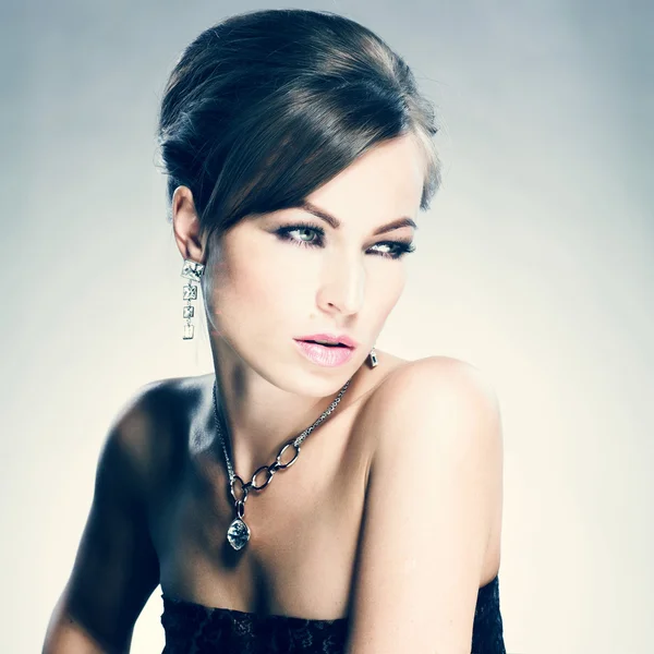 Beautiful woman with evening make-up. Jewelry and Beauty. Fashion photo Stock Photo