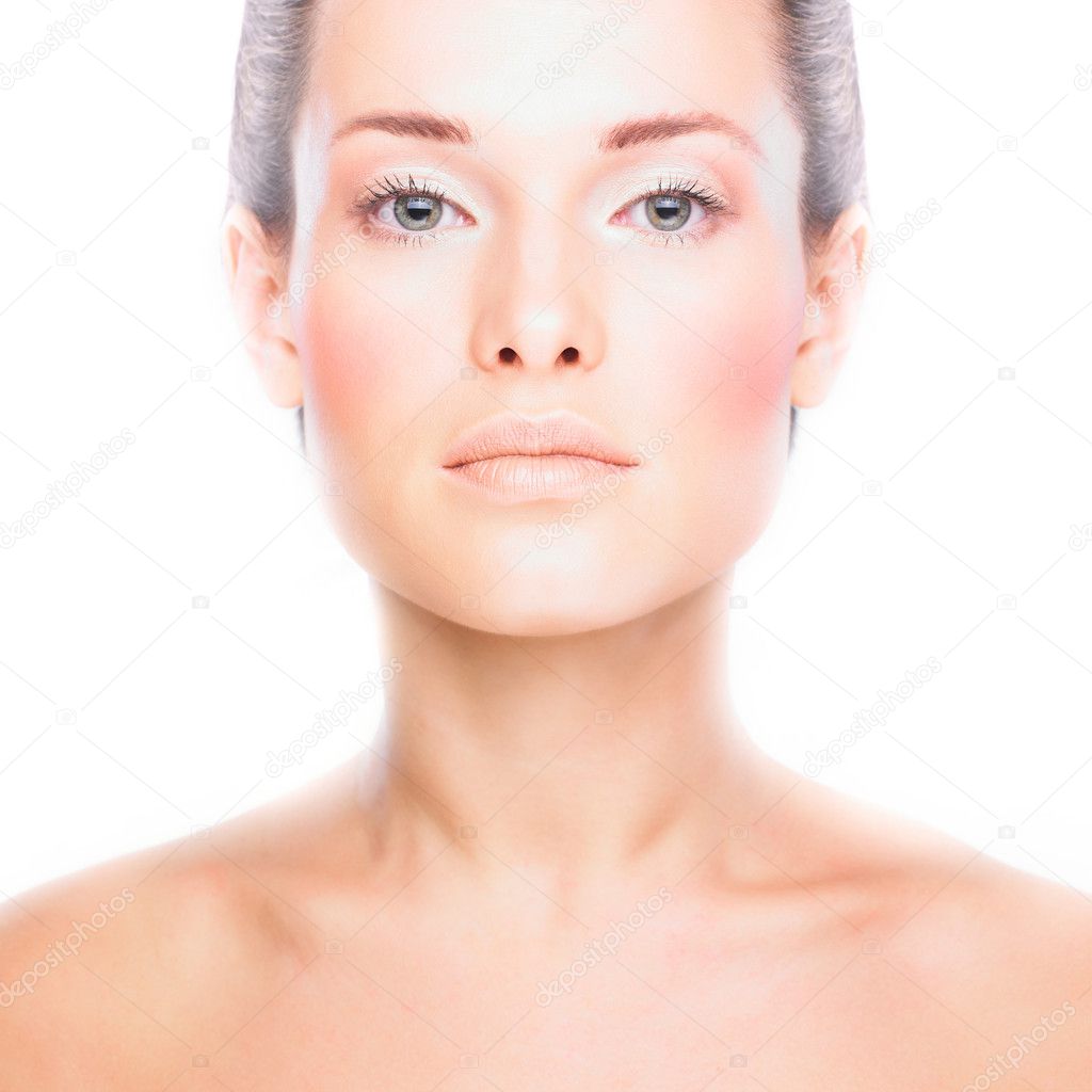Close-up face of beautiful woman with clean fresh healthy skin. Isolated on white