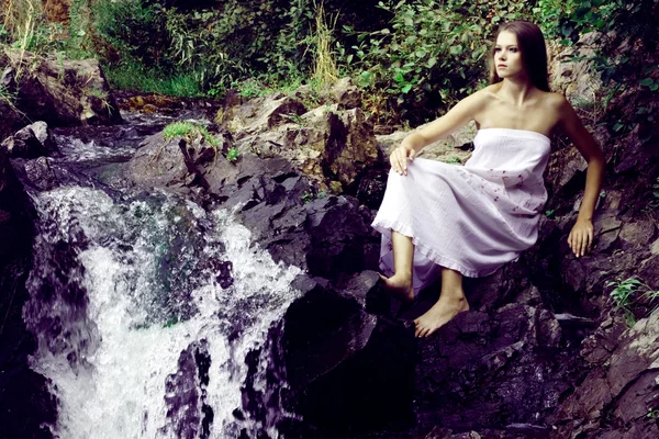 Beautiful girl on stones — Stock Photo, Image