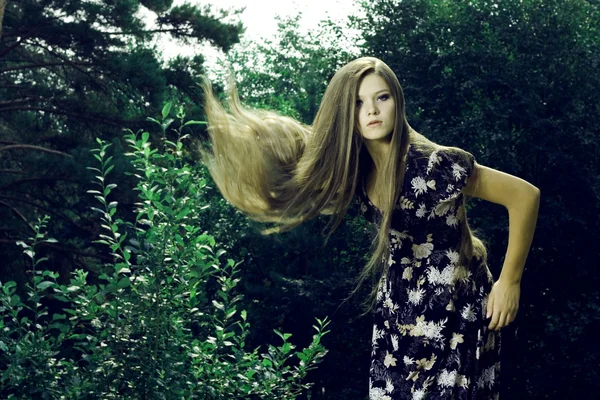 Beautiful girl in a wild forest — Stock Photo, Image