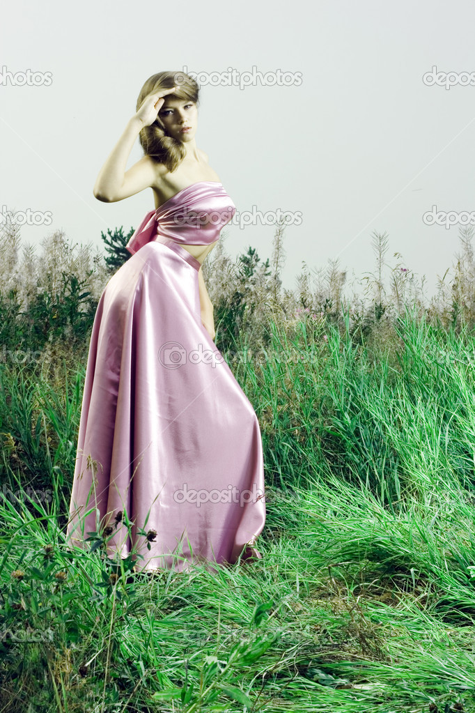 Beautiful girl in green grass