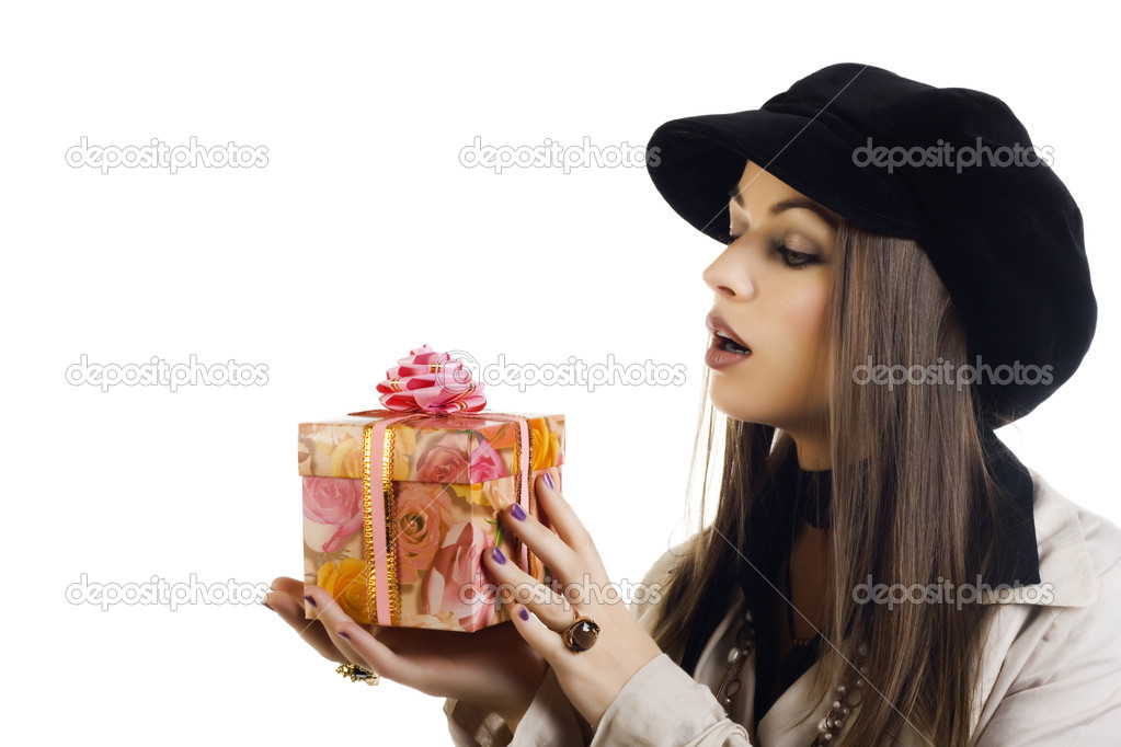 Beautiful girl holding a gift
