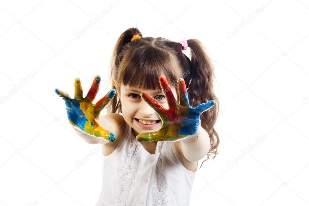 Portrait of a cute cheerful girl with painted hands, isolated over white