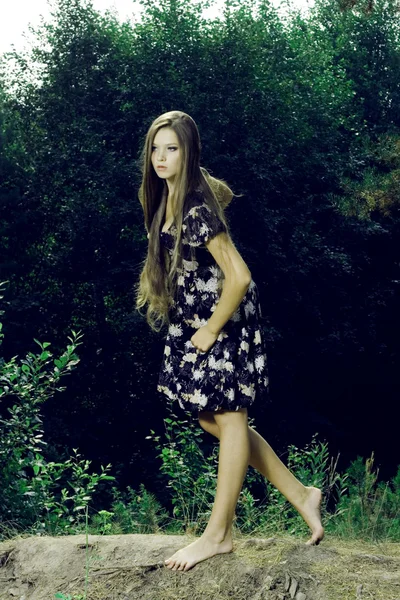 Beautiful girl in a wild forest — Stock Photo, Image