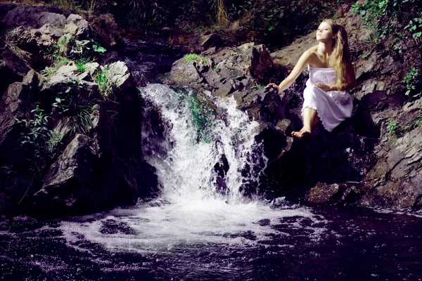 Beautiful girl near a mountain river — Stock Photo, Image