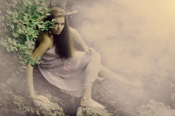 Beautiful girl on stones — Stock Photo, Image