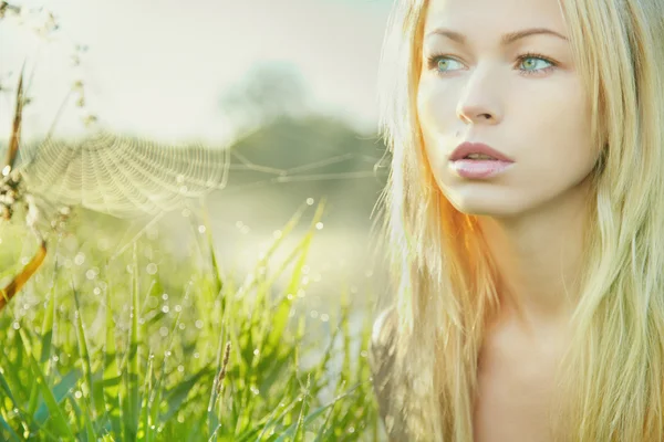 Beautiful young blond woman in sunny day — Stock Photo, Image
