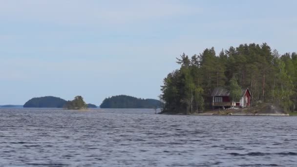 Hus på finish sjö — Stockvideo