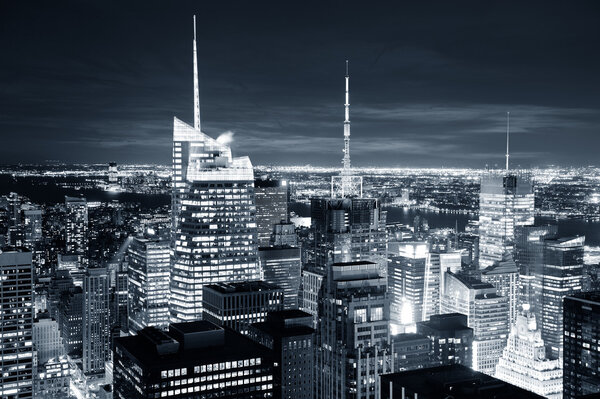 New York City skyline aerial view at dusk with skyscrapers of midtown Manhattan in black and white.