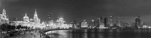 Shanghai Waitan night view with historic buildings over Huangpu River panorama in black and white