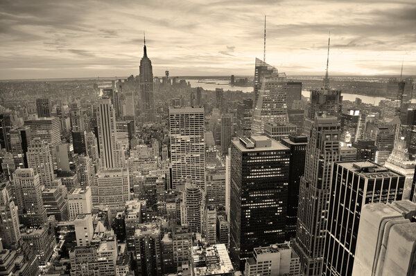 New York City skyline black and white with urban skyscrapers at sunset.