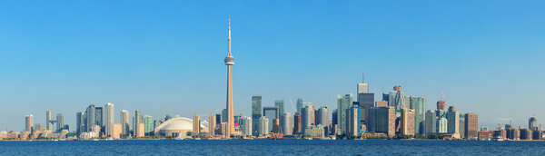 Toronto skyline panorama over lake with urban architecture.